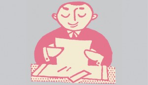 Man_reading_document_at_desk
