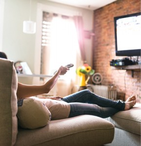 Woman_relaxing_and_watching_tv