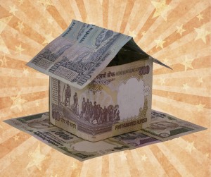 Money_house_on_background