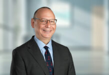 Lawrence Carter returns to DLA Piper